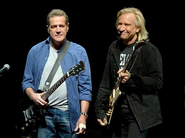 Glenn Frey, left, and Joe Walsh of The Eagles perform on the "History of the Eagles" tour at the Forum, on Wednesday, Jan. 15, 2014 in Los Angeles.