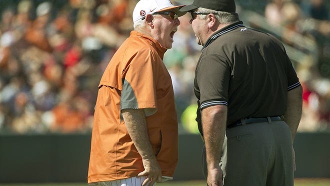 Texas head baseball coach Augie Garrido argues a balk call by first base umpire Tim Henderson on his pitcher Travis Duke in the third inning. Garrido was tossed by Henderson and forced to leave the game. His Texas baseball team took a beating from the Stanford Cardinal Sunday afternoon 11-5 to lose the last game of a three game series at Disch-Falk Field.
