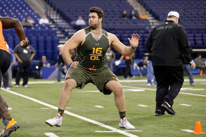 Former OU offensive lineman Gabe Ikard runs a drill at the NFL football scouting combine in Indianapolis on Saturday. Ikard, no longer an NCAA student-athlete, can enjoy all the pasta he can handle. AP Photo