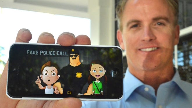 Palm Beach Police Lt. Mick Keenan shows an app he created to allow fake phone calls to children from ‘Officer Friendly.’