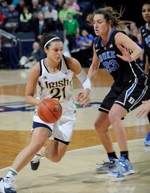 Notre Dame guard Kayla McBride, left, drives the lane as Duke forward Haley Peters defends in the second half of the Fighting Irish's 81-70 victory Sunday.