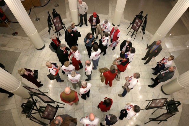 THE ASSOCIATED PRESS / Supporters of Republican gubernatorial hopeful Curtis Coleman wait for their candidates arrival the first day of filing to run for political office at the Arkansas state Capitol in Little Rock on Monday, Feb. 24, 2014. (AP Photo/Danny Johnston)