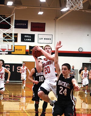 Jack Scheske gets up a shot in transition Tuesday against Marshall in the rivalry contest won by Sturgis.