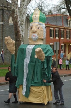"St. Patrick", a float sponsored by the High Street Grill in Mount Holly, rolls along High Street in Mount Holly during the 2012 St. Patrick's Day Parade.