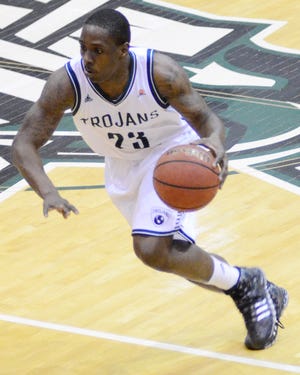 University of Mount Olive senior guard Dory Hines drives the lane during Tuesday’s game against Barton College at Kornegay Arena. Hines took part in pregame Senior Night activities with a large contingent of family, friends, former coaches and fans from Kinston, where he led the Vikings to two state titles.