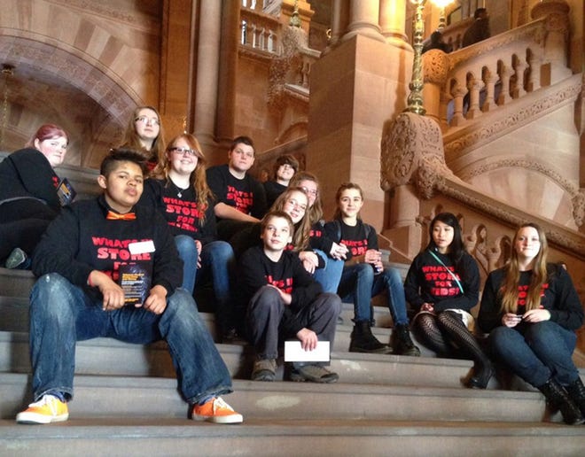 Students from area school districts were among the hundreds of Reality Check members who visited Albany on Feb. 12 to meet with legislators to offer information about the importance of the tobacco control program in the state. Pictured in Albany are members of the local group that made the trip including, front row, left to right: Olivia Welsh, Madison; Brennan Hysell, Madison; Elena Haskins, DeRuyter and a student at Hamilton Central School; and Morgan Fox, of Morrisville. Middle row: Justine Sales, New Hartford; Lauren Hysell, Madison; Madison Hysell, Madison; and Jordyn Camp, Morrisville. Back row: Breeanna Champion, Boonville; Tori Hysell, Madison; Brandon Gotham, Hamilton; and Gabe Camp, Morrisville.