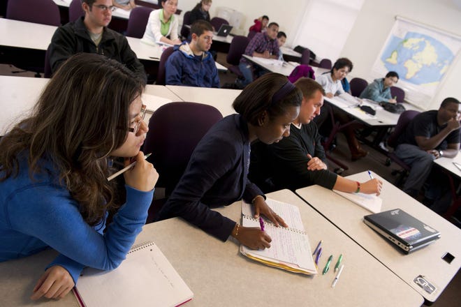 Students take notes during a lecture at Middlesex Community College. Photos courtesy of Middlesex Community College