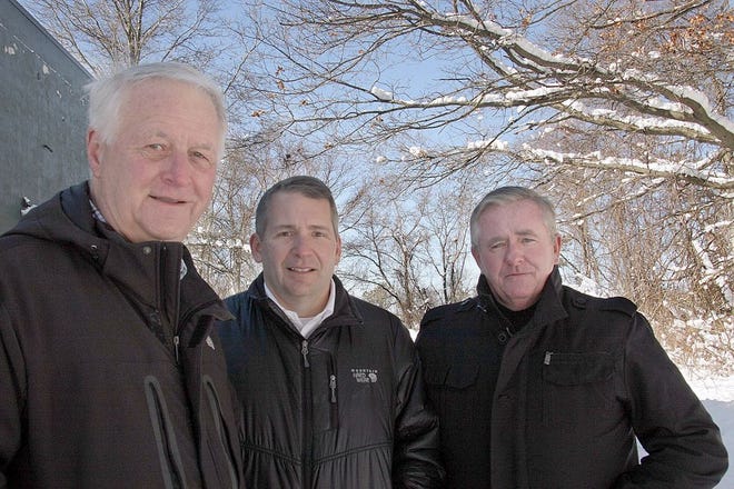 Medical Marijuana of Massachusetts CEO and former U.S. Rep. William Delahunt, poses outside the Collins Avenue site of his marijuana dispensary and growing facility with Medical Marijuana of Massachusetts Director of Community Outreach Kevin O'Reilly and Medical Marijuana of Massachusetts Director of Security Joe Flaherty.