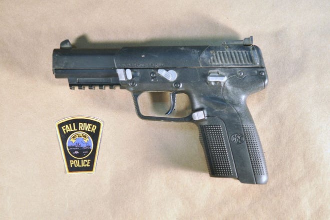 Fall River police said they seized this FN-FiveseveN semi-automatic pistol while serving a search warrant at 301 Quequechan St.