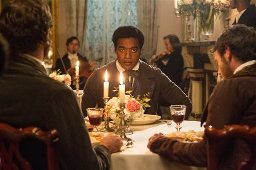 Chiwetel Ejiofor in a scene from "12 Years A Slave." This year's best picture race at the 86th Academy Awards on Sunday, March 2, 2014, has shaped up to be one of the most unpredictable in years. The favorites are "12 Years a Slave," "Gravity" and "American Hustle."