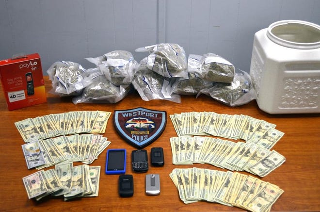 Westport police said they seized eight pounds of pot, $5,000 in cash, cellphones and a ledger in a raid.
