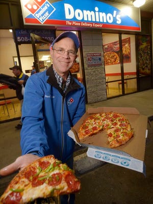 Seth Hockert-Lotz is seen outside his Domino's Pizza on South Main Street.