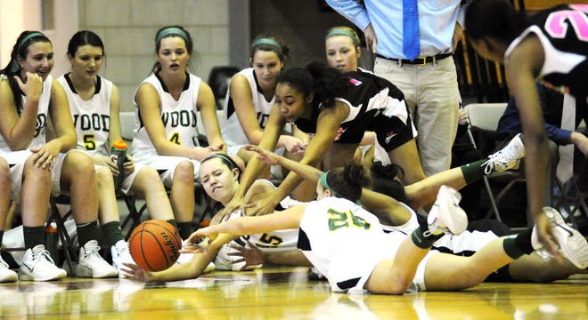 PHILADELPHIA, PA - MARCH 1: Archbishop Wood and Mastery Charter players scramble on the floor for a loose ball in the second half of the girl's District 12 championship March 1, 2014 at St. Joseph Prep in Philadelphia, Pennsylvania. (Photo by William Thomas Cain/Cain Images)