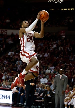 Oklahoma Sooner Buddy Hield (24) shoots on a fast break in the second half as the University of Oklahoma Sooners (OU) men defeat the Texas Longhorns (TU) 77-65 in NCAA, college basketball at The Lloyd Noble Center on Saturday, March 1, 2014 in Norman, Okla. Photo by Steve Sisney, The Oklahoman