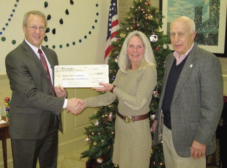 Piscataqua Savings Bank has made a $1,500 donation to Madam Ovary, the Elizabeth Bennett Rice Fund for Ovarian Cancer Research, Education and Awareness. From left, Rick Wallis, Julie Kennedy and Peter Rice.