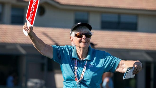 Roberta Lessmen, 82, of Boca Raton has volunteered at the Honda Classic for 26 years. She is a “husher,” telling the crowd to be quiet while players are preparing their shots.