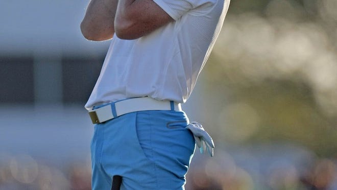 Rory Mcilroy, reacts to a miss birdie on the 18th green during third round of the 2014 Honda Classic Saturday, Feb 26, 2014 at PGA National in Palm Beach Gardens. (Bill Ingram / Palm Beach Post)