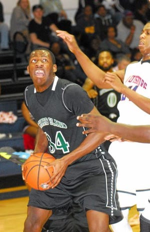 Geoff Neville/THE FRANKLIN TIMES
Richard Bland center Avery Ugba (34) had eight points and a game-high 14 rebounds in a 96-73 loss at Louisburg (N.C.) College on Saturday.
