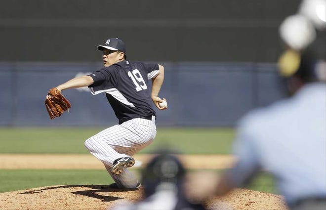 New York Yankees pitcher Masahiro Tanaka throws a pitch during an exhibition baseball game against the Philadelphia Phillies Saturday, March 1, 2014, in Tampa, Fla. (AP Photo/Charlie Neibergall)