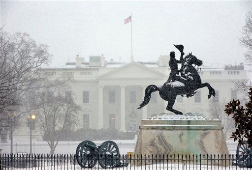 The statue of President Andrew Jackson at the Battle of New Orleans, sculpted in 1853 by Clark Mill sits in the falling snow in Lafayette Park across the street from the White House in Washington, Monday.