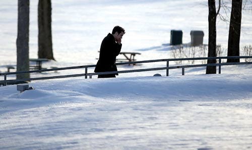 Photo by Daniel Freel/New Jersey Herald - A man walks on the Sussex County Community College campus in Newton during a frigid day Monday.