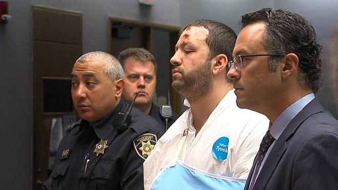 Eric Souza, 29, of Assonet, Mass., third from left, appears in District Court on Monday, where he was charged with murder and conspiracy after 22-year-old Satchel Ramos was stabbed to death early Sunday at the intersection of Atwells Avenue and Dean Street.