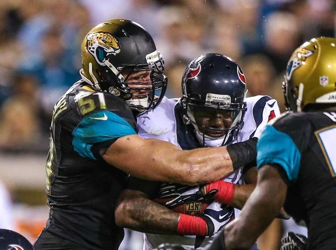 Gary McCullough For the Times-Union The Jaguars' Paul Posluszny (51) tackles the Texans' Ben Tate on Dec. 5 at EverBank Field.