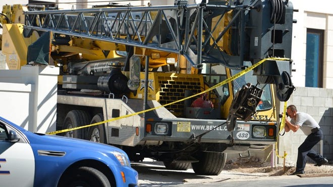 A crane struck and killed a pedestrian Tuesday morning on South County Road and Royal Palm Way.