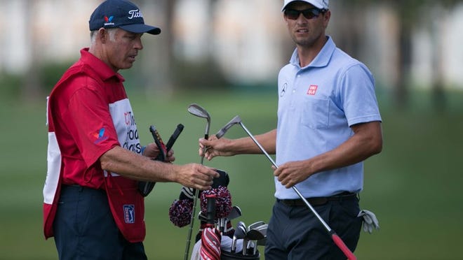 Caddie Steve Williams with Adam Scott during the second round of the Honda Classic in Palm Beach Gardens, Florida on February 28, 2014. (ALLEN EYESTONE / THE PALM BEACH POST)