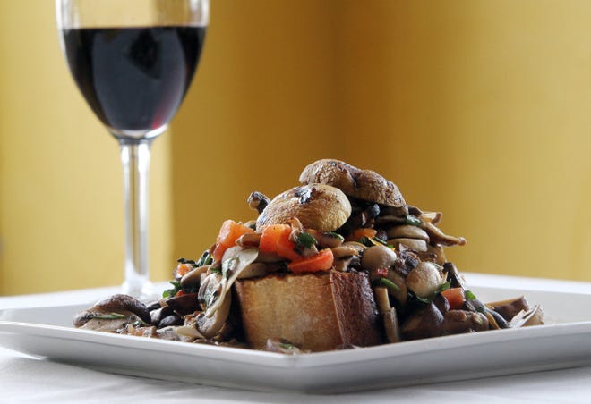 Wild and domestic mushrooms over grilled crostini from Adesso.