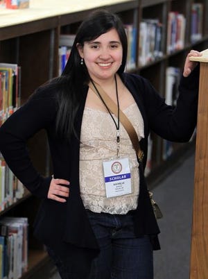 (Photo Mike Hensdill/The Gaston Gazette) North Gaston student Michelle Blanco is back in town after attending the Congress of Future Medical Leaders in Washington D.C.. Here, she poses for a photo in the library at North Gaston High School in Dallas Thursday morning, March 6, 2014.