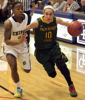 Palm Beach State's #10 Veronica Ryan, right, drives past Chipola's #0 Diamonisha Sophus in the first half. Ryan is the daughter of CF men's head basketball coach Tim Ryan and a former Ocala Star-Banner player of the year from West Port. The Chipola Indians defeated the Palm Beach State Panthers 63-38 in the FCSAA State Women's Basketball Tournament, Thursday night March 6, 2014 at the College of Central Florida in Ocala, FL.