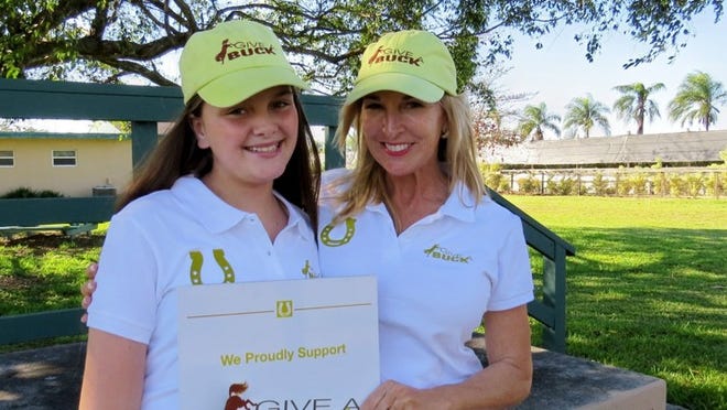 Give a Buck Founder Sissy DeMaria (right) with Young Ambassador Daniella Galceran, 11, at Good Hope Equestrian Training Center in Miami. Give a Buck recently started a chapter in Palm Beach County and is looking for Young Ambassadors.