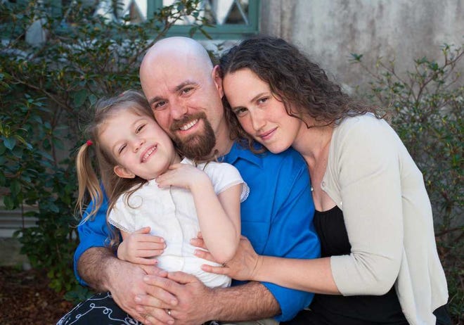 Trinity Episcopal Parish of St. Augustine's first full-time youth minister Nick Altman poses with his wife Beverly and daughter Aiyla. Contributed