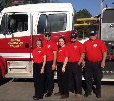 Courtesy of Freddy Howell BCES firefighters EMT Denise Youmans, left, Lt. Ben Pape, Stacie Aldrich, Kevin Aldrich and Tim Stillwell wear red shirts supporting the American Heart Association.