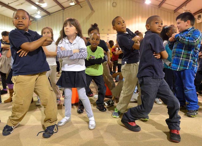 Students dance during a Radio Disney Dance Party at Oglethorpe Avenue Elementary School on Friday, March 7, 2014, in Athens, Ga.  (Richard Hamm/Staff) OnlineAthens / Athens Banner-Herald