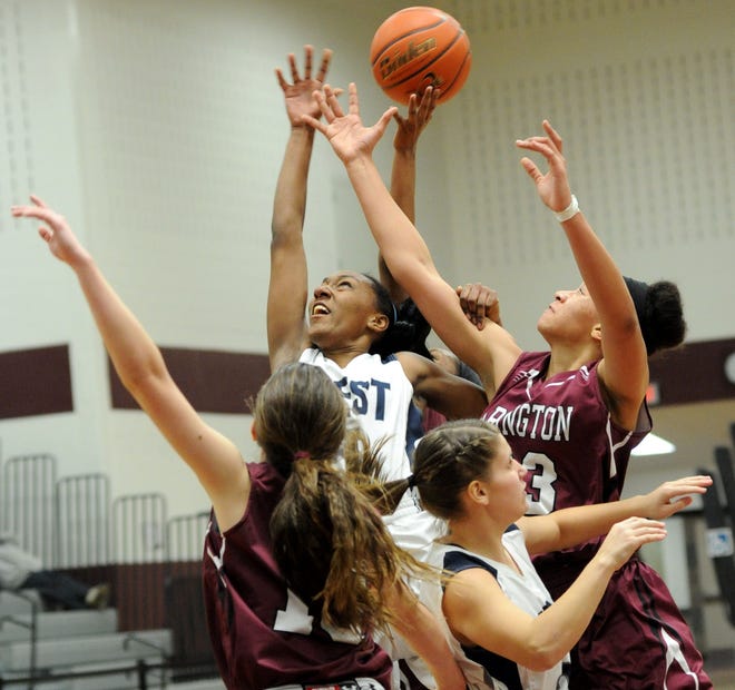 Pocono Mountain West's Jackie Benitez fights for a rebound against several Abington players during their state playoff game held in Stroudsburg on Friday, March 7, 2014.