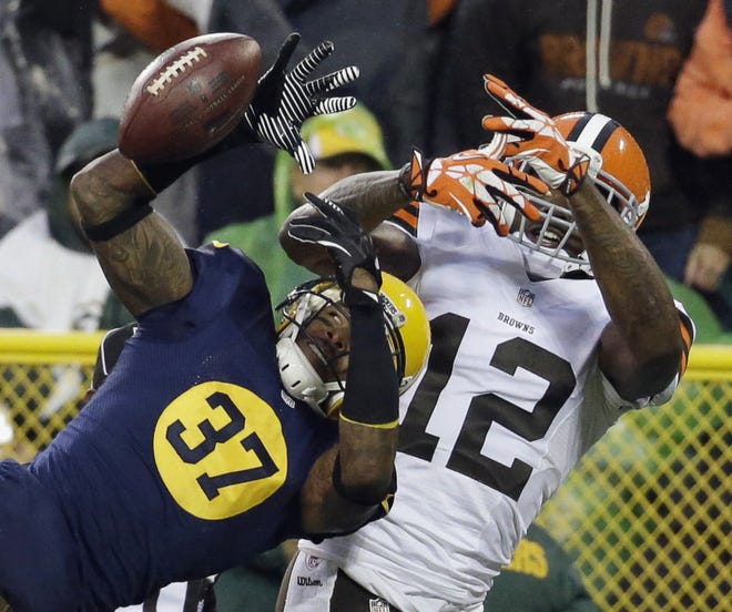 Green Bay Packers' Sam Shields (37) breaks up a pass intended for Cleveland Browns' Josh Gordon (12) during the second half of a game Oct. 20, 2013, in Green Bay, Wis. (AP Photo/Morry Gash)