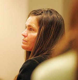 Herald file photo - Julie Michaels listens to closing argumenmts at her trial in Newton March 15, 2011. A Sparta attorney argued before the state Supreme Court Tuesday that Michaels should get a retrial.
