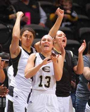 Megan Holloway and the rest of the Emporia State bench celebrate as they down the Southwest Baptist Bearcats 90-69, Saturday, in the 2014 MIAA Tournament Semifinals at Municipal Auditorium in Kansas City, Mo.