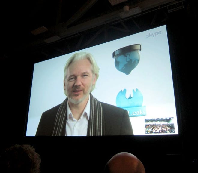 Fugitive WikLeaks founder Julian Assange speaks via Skype at the South By SouthWest Interactive festival in Austin, Texas, Saturday, March 8, 2014. Assange's appearance underscores the increasing attention that the technology industry is paying to issues of online privacy, security and surveillance. (AP Photo/Barbara Ortutay)