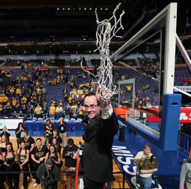 Wichita State coach Gregg Marshall waves to fans after cutting down the net after the Shockers defeated Indiana State, 83-69, in the Missouri Valley Conference Tournament title game on Sunday in St. Louis.
