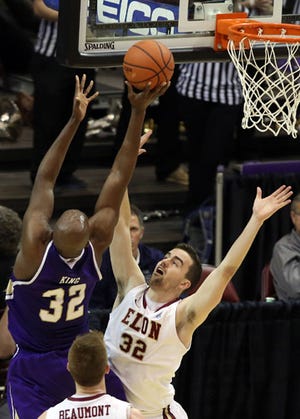 Western Carolina's Tawaki King shoots over Elon's Ryan Winters on Saturday at the Southern Conference Tournament.