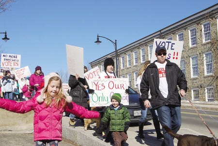 Hundreds gathered Sunday for a walking rally in support of the building of a new junior/senior high school in Newmarket.