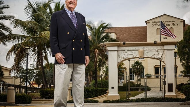 Simon Benson Offit in outside the Dreyfoos School of the Arts arch on Sapodilla Avenue in West Palm Beach. (Thomas Cordy / The Palm Beach Post)