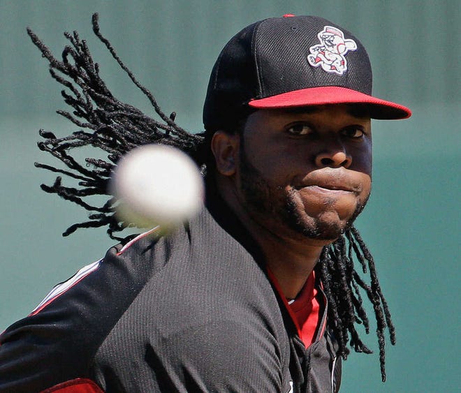 Cincinnati Reds' Johnny Cueto throws before the first inning of an exhibition spring training baseball game against the Los Angeles Angels Sunday, March 9, 2014, in Tempe, Ariz. (AP Photo/Morry Gash)