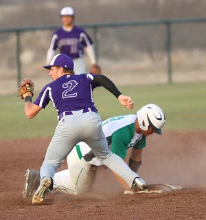 Early’s Kellan Jackson (2) awaits the ruling by the field umpire after tagging Bangs’ Tanner Shaw at second base during the bottom of the first inning of the Longhorns’ 4-2 District 6-2A road victory.