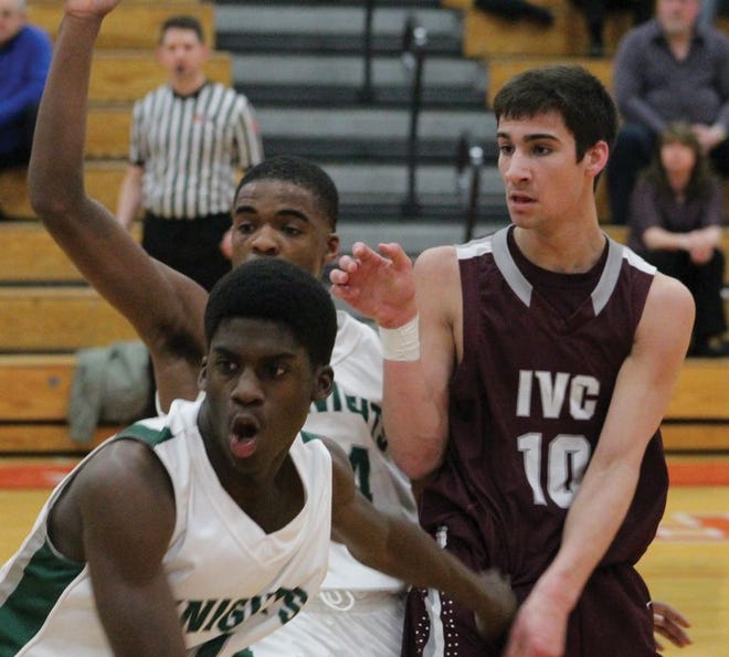 IVC senior Ben Rashid looks for an opening to receive a pass through the Richwoods defense at the Regional game March 5. Rashid contributed three steals for the Grey Ghosts.