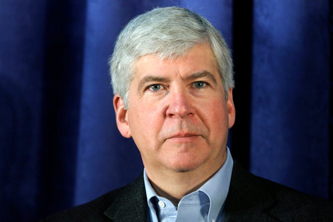 FLINT, MI - JANUARY 24: Michigan Gov Rick Snyder attends a press conference at the General Motors Flint Assembly Plant January 24, 2011 in Flint, Michigan. In response to customer demand GM announced they are adding a third shift and an estimated 750 jobs at the plant. (Photo by Bill Pugliano/Getty Images)