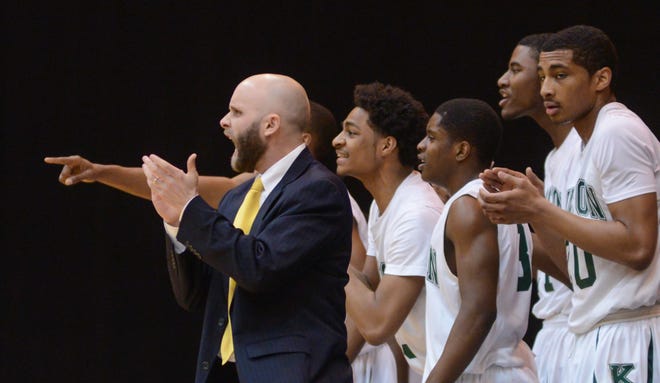 Kinston coach Perry Tyndall celebrates Saturday at the Crown Arena in Fayetteville.